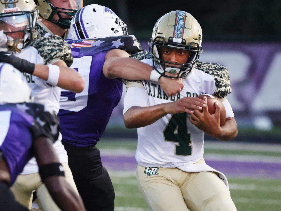 Catawba Ridge’s Davin Latimer carries the ball as the Copperheads compete with Ardrey Kell Friday, Sept. 8, 2023 in Charlotte, N.C.