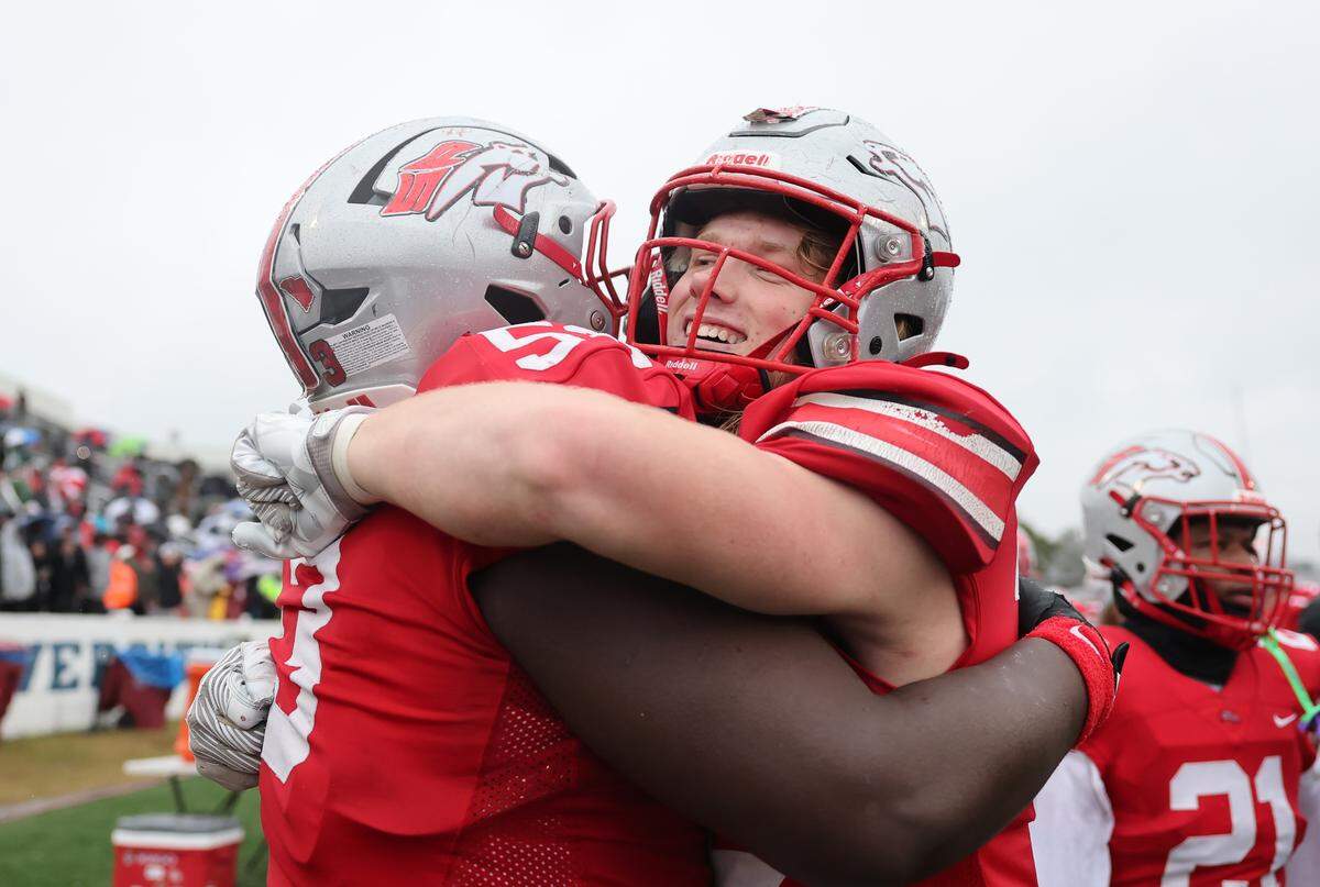 South Pointe High School's Miles Wilson, left, and Brysen Ginn celebrate after winning the SC High School League Class 4A football championship in Orangeburg, S.C. on Saturday, Dec. 6, 2025.