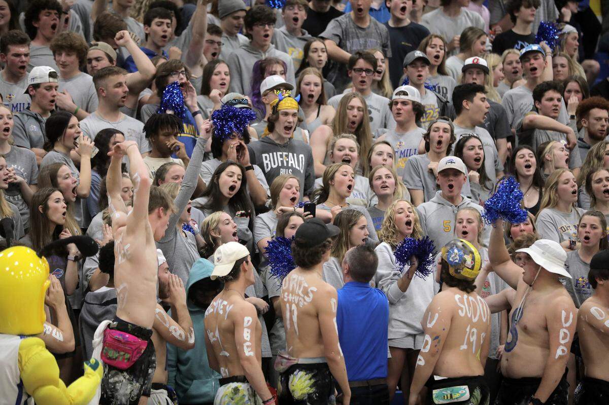 Fort Mill High School students yell from the cheering section Monday as the Yellow Jackets take on the Ridgeview High School Blazers boys basketball team in Fort Mill.