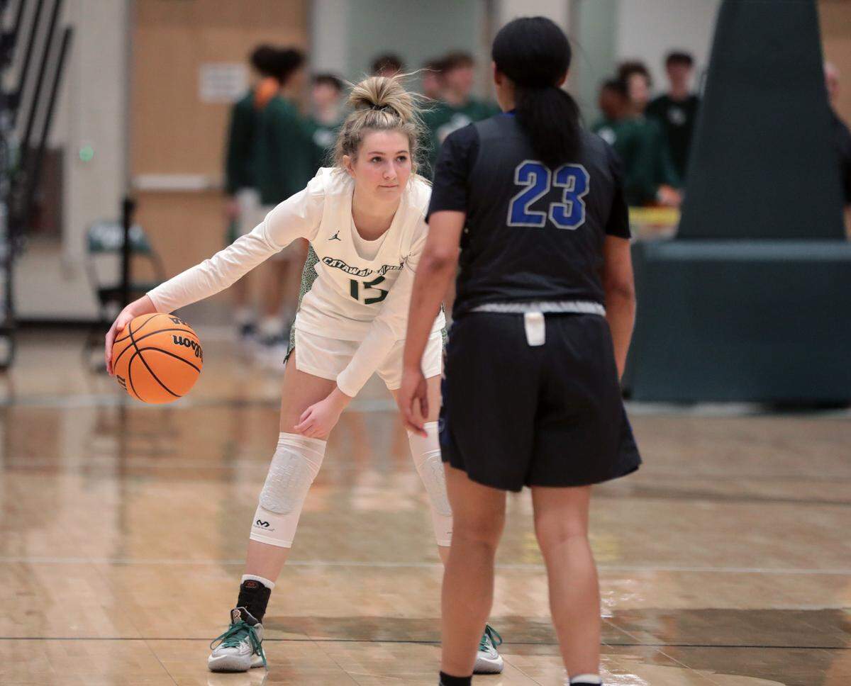 Catawba Ridge’s Skyla Tuthill waits for the clock to run out as Indian Land’s Carrigan McCloud watches.