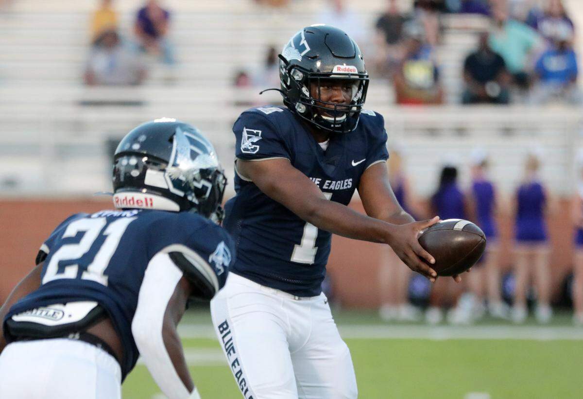 Clover’s Joe Boyd hands the ball to Jackson Coon as the Blue Eagles take on the Northwestern Trojans. Clover faces Boiling Springs on Friday (Oct. 15).