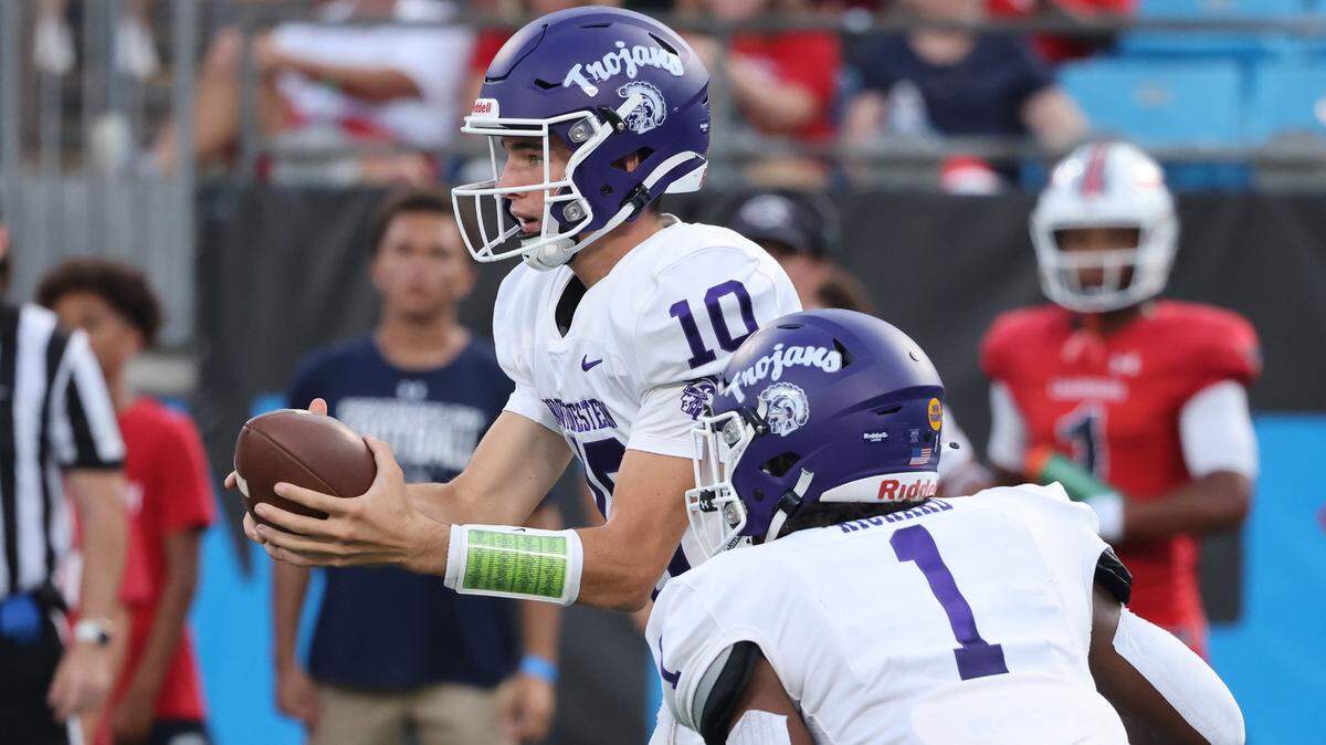 Northwestern’s Finley Polk hands off the ball to Turbo Richard