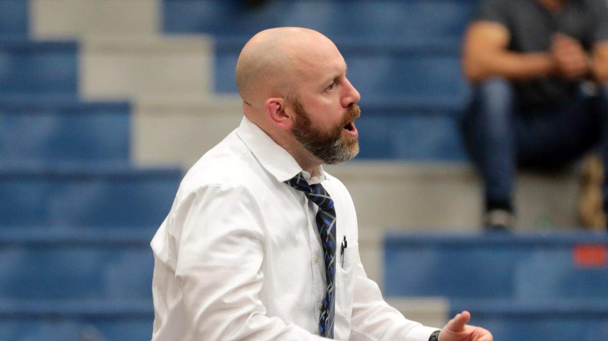 Clover High School wrestling coach Mike Fitzgerald talks to a wrestler.