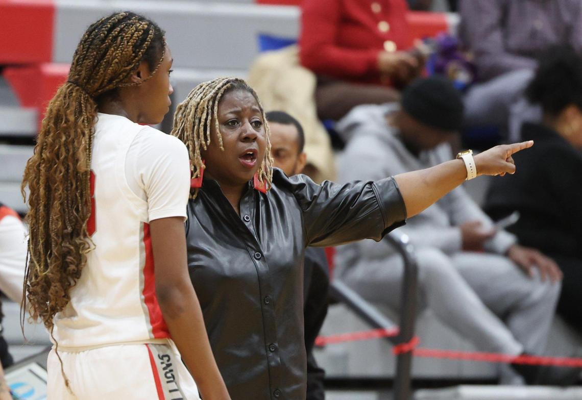 South Pointe girls varsity head coach Stephanie Butler-Graham talks to a player Thursday in Rock Hill.