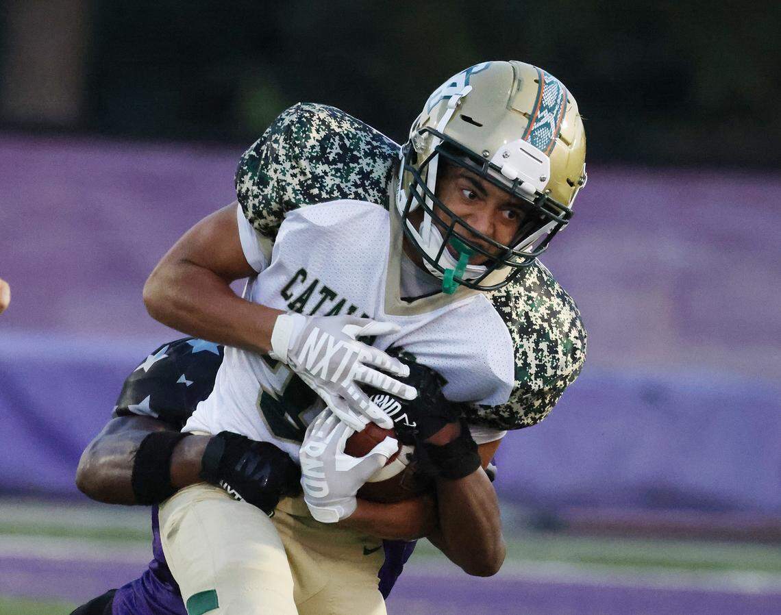 Ardrey Kell’s Chancellor Bryant tackles Catawba Ridge’s Nolan Jones on Friday, Sept. 8, 2023 in Charlotte, N.C.
