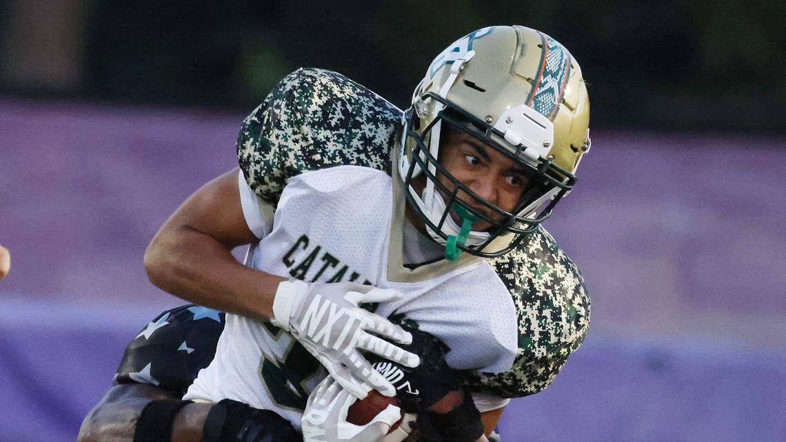 Ardrey Kell’s Chancellor Bryant tackles Catawba Ridge’s Nolan Jones on Friday, Sept. 8, 2023 in Charlotte, N.C.