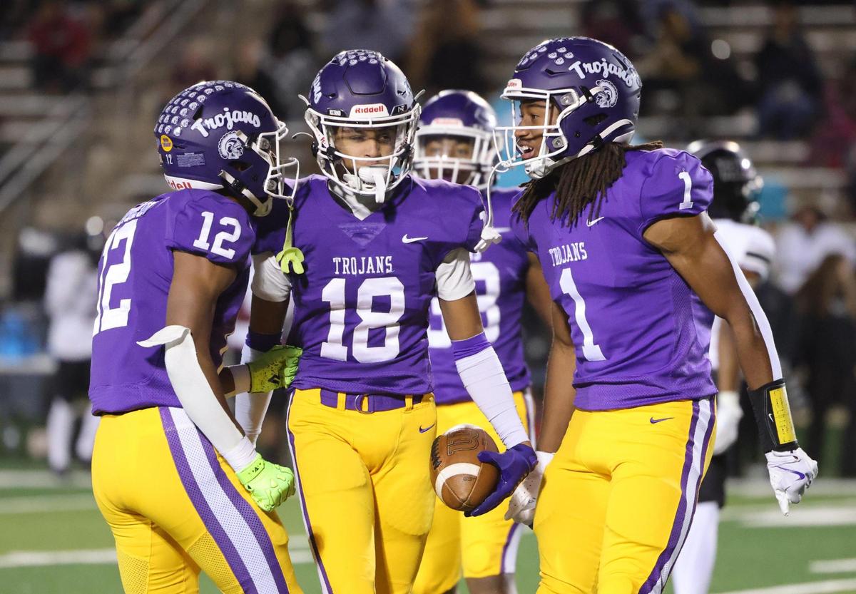 Northwestern’s Jonathan Spurgeon (12), Jayden Baxter (18) and Tamarion Watkins (1) celebrate Friday, Oct. 18, 2024 in Rock Hill, S.C.